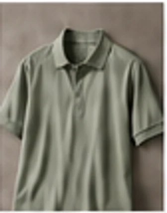 Performance golf polo and lightweight layer arranged on a clean surface